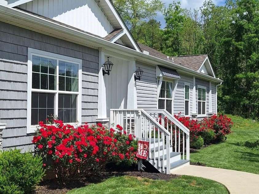 52 Stone Ridge Trail, Mills River, NC 28759.  MLS# CAR4239861, YatesRealty ID 4935. Rose bushes in bloom in summer