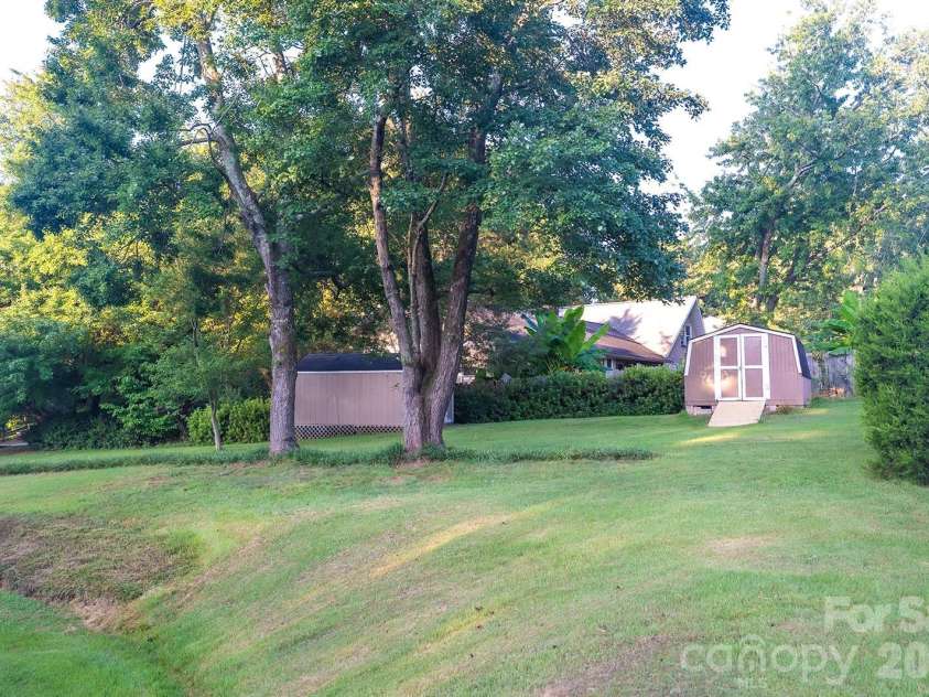 3401 Tracelake Drive, Matthews, NC 28105.  MLS# CAR4417359, YatesRealty ID 49352. Backyard with 2 sheds!