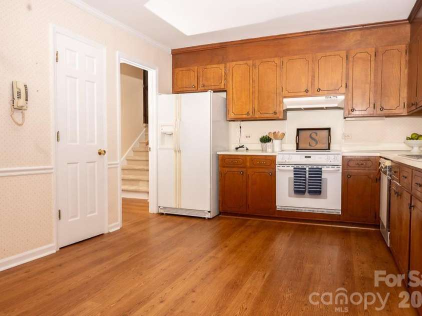 3401 Tracelake Drive, Matthews, NC 28105.  MLS# CAR4417359, YatesRealty ID 49352. Kitchen by Dining Room