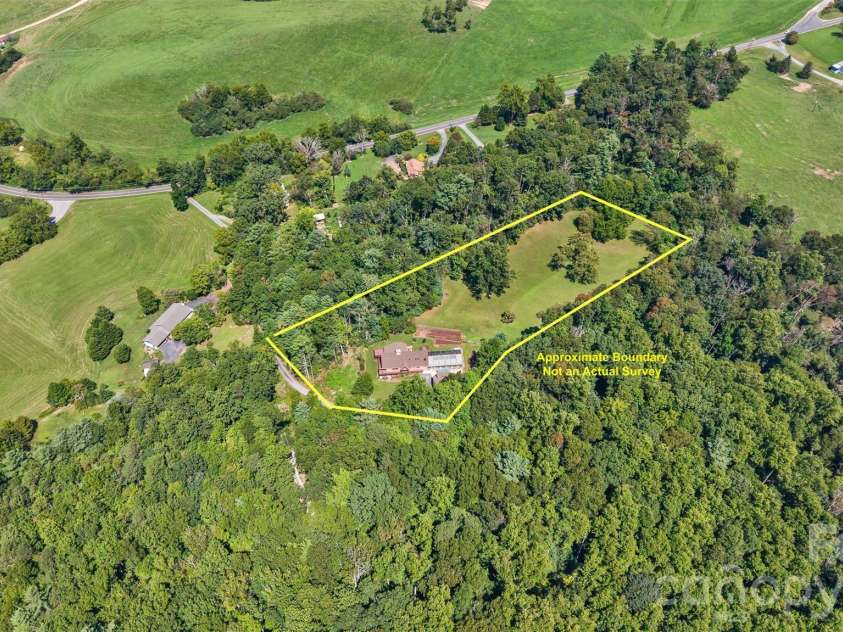 16 Spruce Way, Fairview, NC 28730.  MLS# CAR4421539, YatesRealty ID 49354. The wooded surroundings provide a great buffer from adjoining properties.