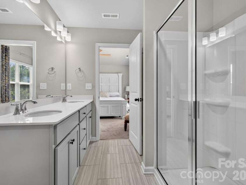5224 Belstone Lane, Charlotte, NC 28215.  MLS# CAR4419844, YatesRealty ID 49356. Primary bathroom on 2nd floor