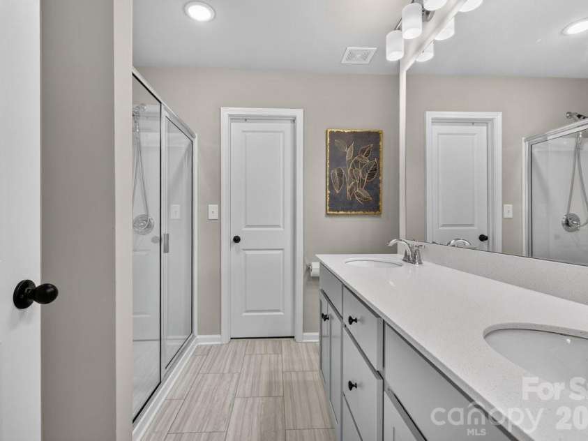 5224 Belstone Lane, Charlotte, NC 28215.  MLS# CAR4419844, YatesRealty ID 49356. Primary bathroom on 2nd floor