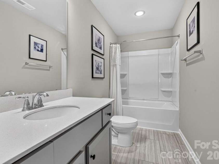 5224 Belstone Lane, Charlotte, NC 28215.  MLS# CAR4419844, YatesRealty ID 49356. Secondary bathroom on 2nd floor