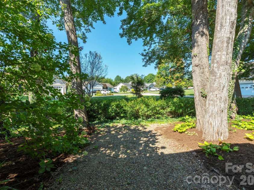 38 Eden Glen Road, Black Mountain, NC 28711.  MLS# CAR4421255, YatesRealty ID 49363. Backyard offers extra space for gardening, play, or a future patio
