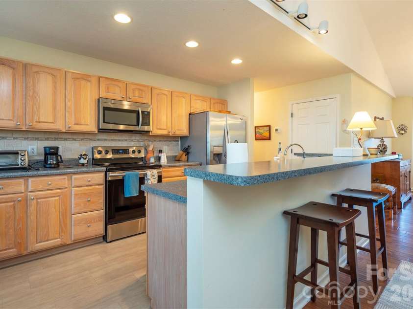 38 Eden Glen Road, Black Mountain, NC 28711.  MLS# CAR4421255, YatesRealty ID 49363. Open kitchen with breakfast bar seating