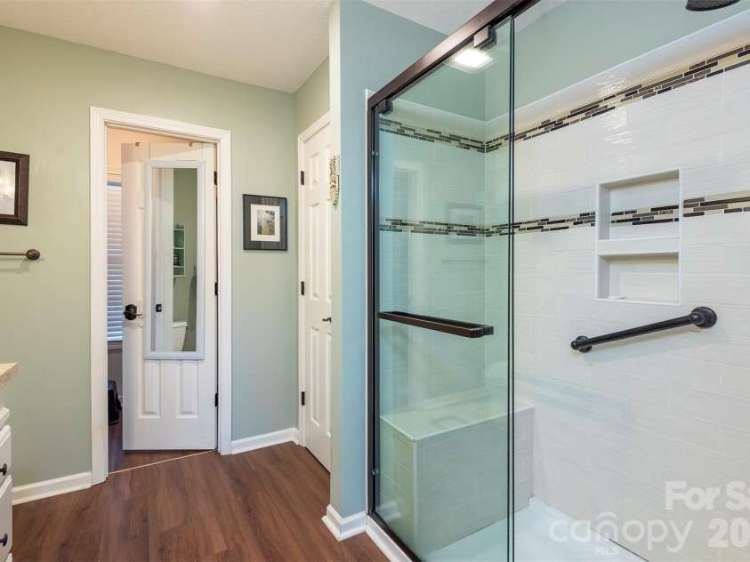 38 Eden Glen Road, Black Mountain, NC 28711.  MLS# CAR4421255, YatesRealty ID 49363. Primary bath features a walk-in shower and walk-in closet