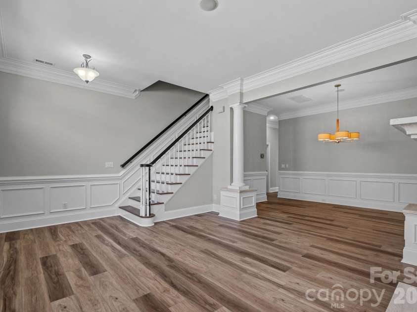 6415 Wakehurst Road, Charlotte, NC 28226.  MLS# CAR4420988, YatesRealty ID 49365. Living room into dining room