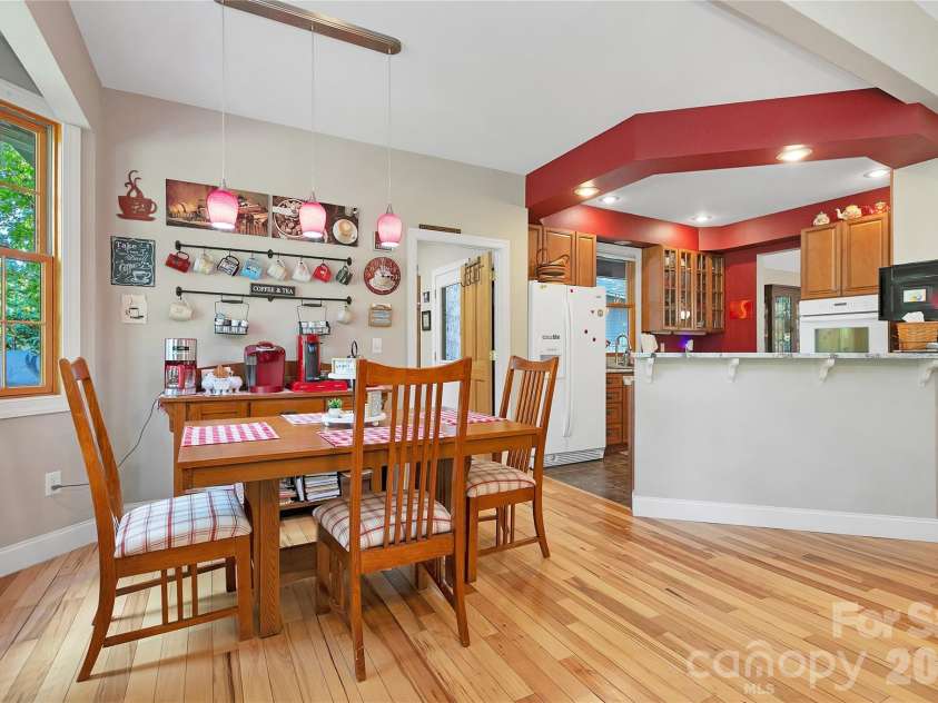 111 Kanunu Court, Brevard, NC 28712.  MLS# CAR4422371, YatesRealty ID 49387. Breakfast area is off the open concept Kitchen