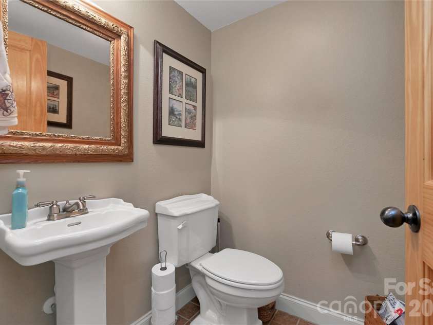 111 Kanunu Court, Brevard, NC 28712.  MLS# CAR4422371, YatesRealty ID 49387. Half bath between Entryway and Great Room