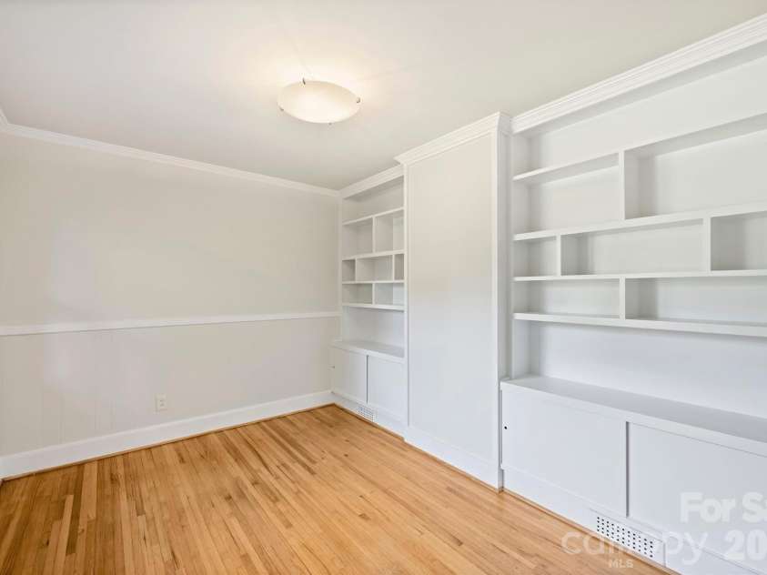 9436 Glen Brook Drive, Charlotte, NC 28215.  MLS# CAR4422159, YatesRealty ID 49389. Office with built in shelving