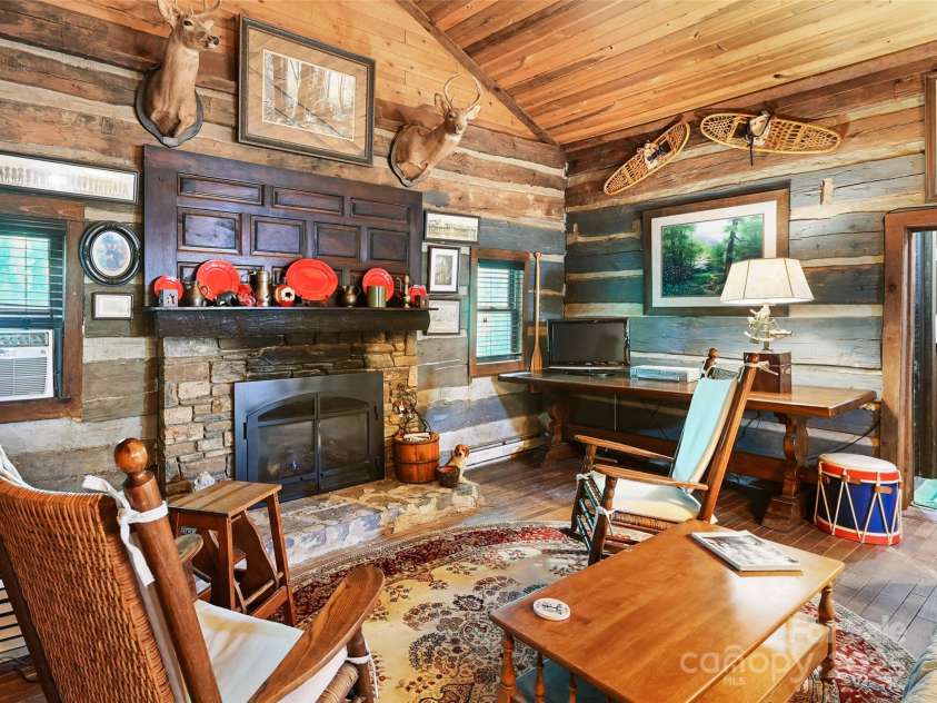 88 Chestnut Forest Road, Fairview, NC 28730.  MLS# CAR4171561, YatesRealty ID 494. A Mendota gas furnace warms the comfortable living space from the stunning stone hearth