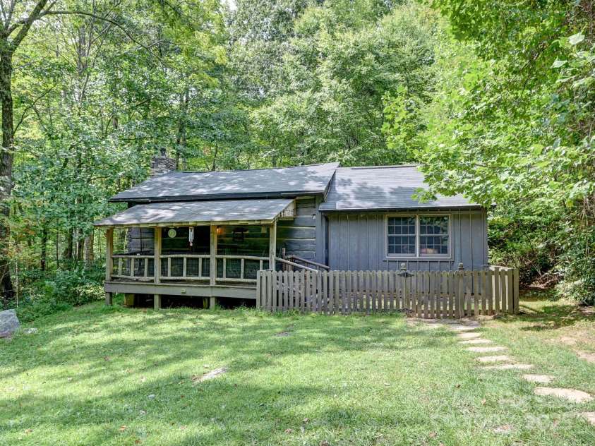 88 Chestnut Forest Road, Fairview, NC 28730.  MLS# CAR4171561, YatesRealty ID 494. Charming, rustic and cozy cabin in Fairview Forest on 13.71 acres