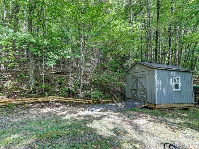 88 Chestnut Forest Road, Fairview, NC 28730.  MLS# CAR4171561, YatesRealty ID 494. Included outbuilding for outdoor toys or additional storage