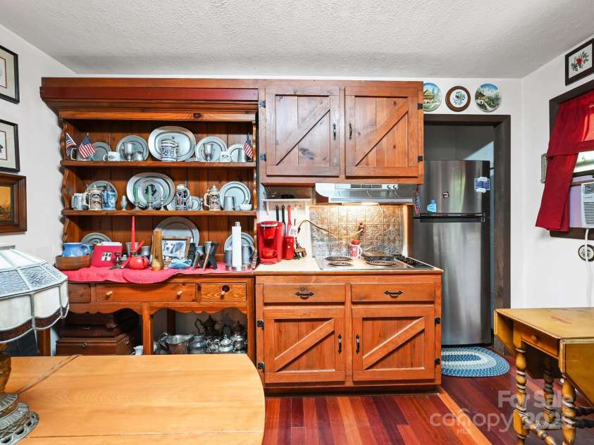 88 Chestnut Forest Road, Fairview, NC 28730.  MLS# CAR4171561, YatesRealty ID 494. The kitchen features a well-thought-out design with ample storage and counter space, making it easy to organize and prepare meals efficiently