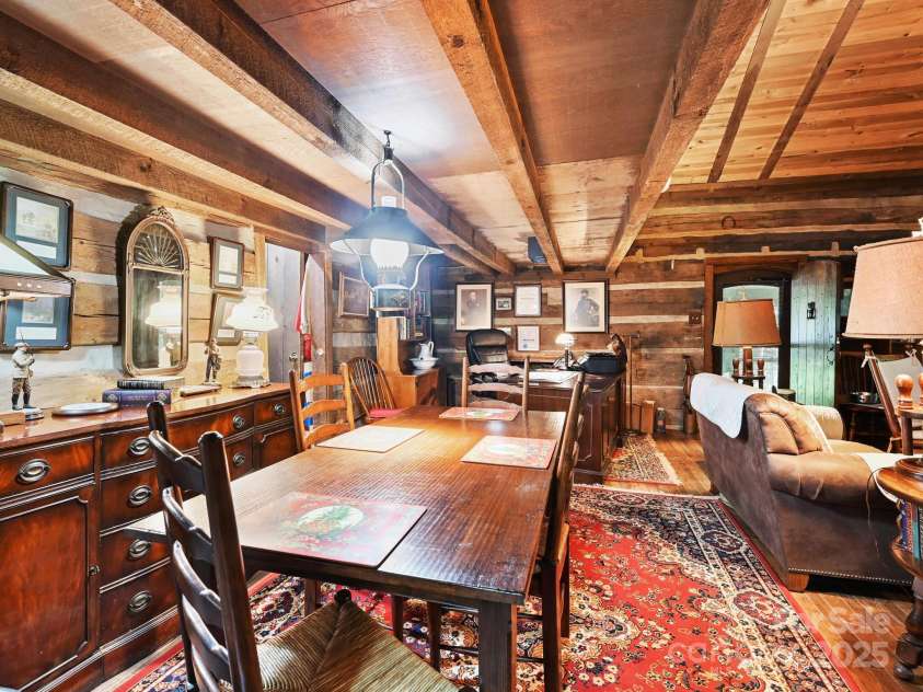 88 Chestnut Forest Road, Fairview, NC 28730.  MLS# CAR4171561, YatesRealty ID 494. The rustic charm of the cabin enhances the appeal of this area, making it perfect for relaxing with a puzzle