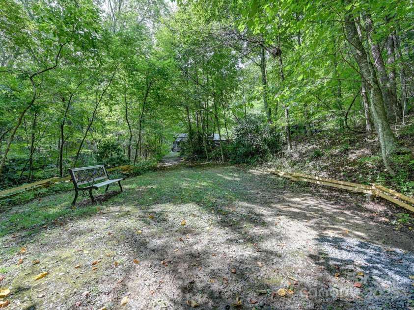 88 Chestnut Forest Road, Fairview, NC 28730.  MLS# CAR4171561, YatesRealty ID 494. Time for a stroll or a sit, just another place to appreciate the beauty of the mountains