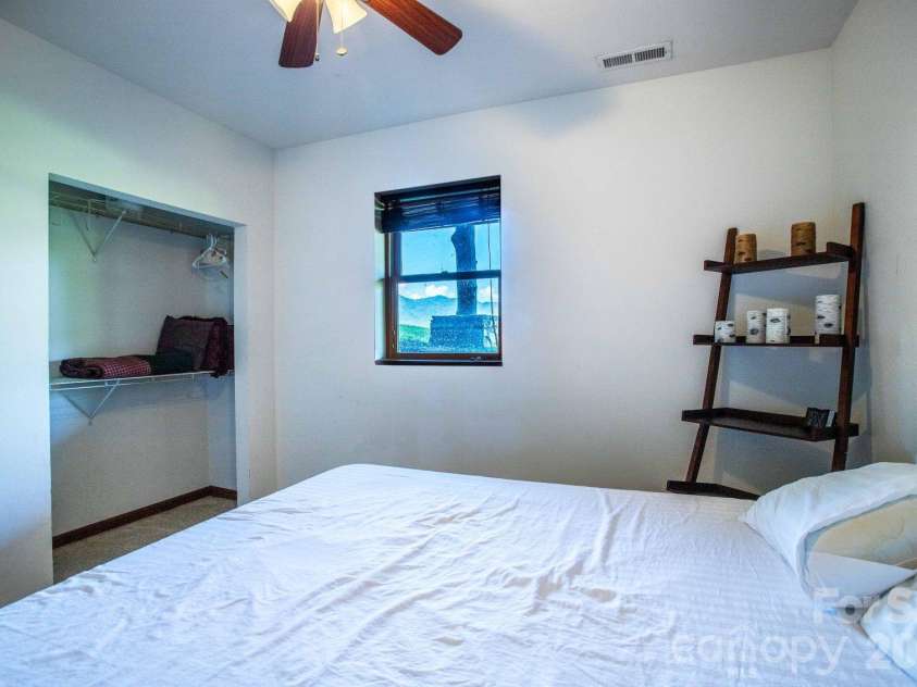 891 Logans Ridge Road, Marshall, NC 28753.  MLS# CAR4411143, YatesRealty ID 49403. Lower level bedroom