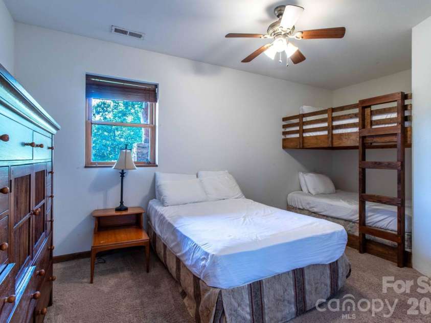 891 Logans Ridge Road, Marshall, NC 28753.  MLS# CAR4411143, YatesRealty ID 49403. Lower level bedroom