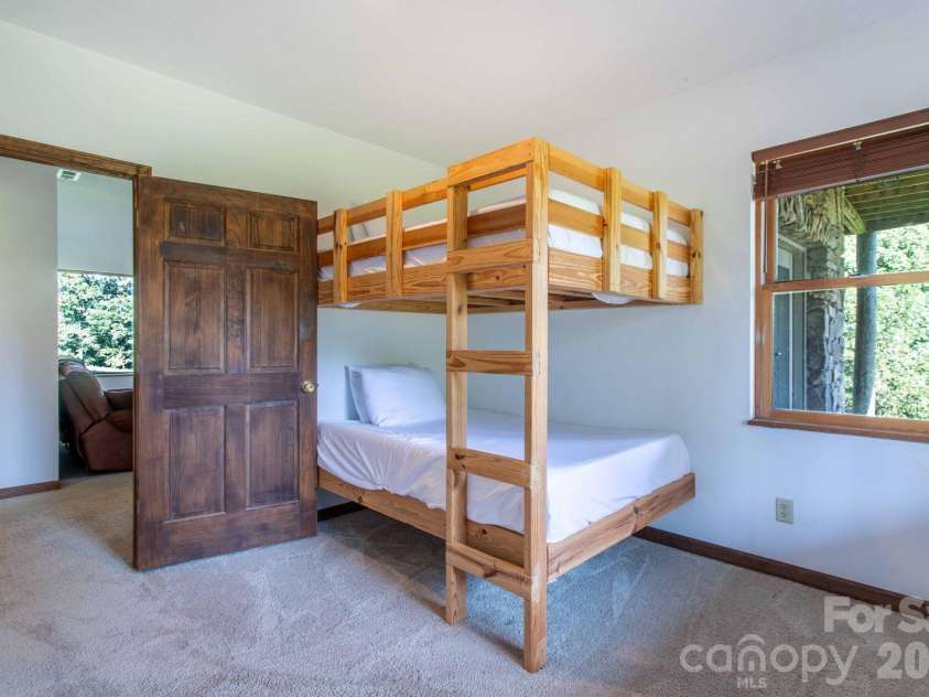 891 Logans Ridge Road, Marshall, NC 28753.  MLS# CAR4411143, YatesRealty ID 49403. Lower level bedroom
