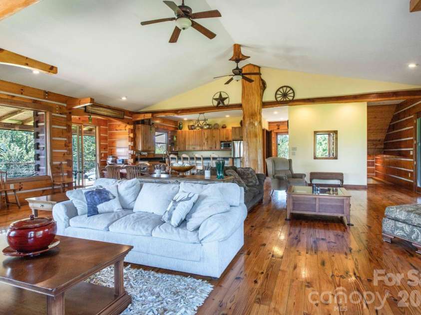 891 Logans Ridge Road, Marshall, NC 28753.  MLS# CAR4411143, YatesRealty ID 49403. Sitting in front of the fireplace