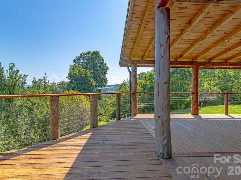 891 Logans Ridge Road, Marshall, NC 28753.  MLS# CAR4411143, YatesRealty ID 49403. Wide and deep deck on three sides