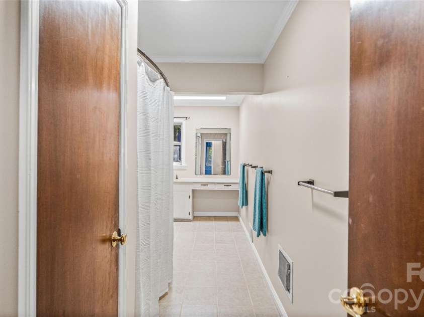 41 Elm Street, Badin, NC 28009.  MLS# CAR4402838, YatesRealty ID 49405. Entry into main bathroom
