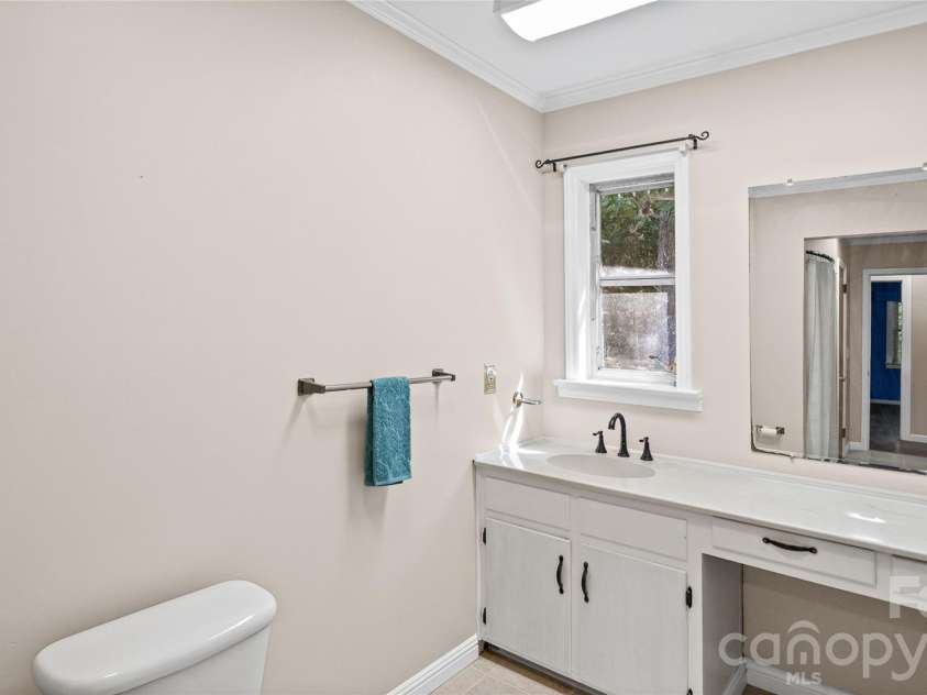 41 Elm Street, Badin, NC 28009.  MLS# CAR4402838, YatesRealty ID 49405. Spacious main bathroom with vanity station