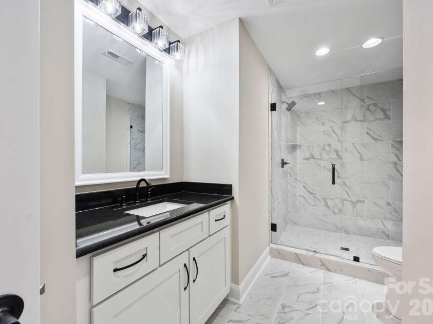 200 Ridge Road, Troy, NC 27371.  MLS# CAR4422497, YatesRealty ID 49417. Basement Bathroom