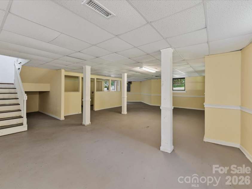 9821 Harvest Lane, Davidson, NC 28036.  MLS# CAR4422485, YatesRealty ID 49465. Expansive finished lower level offers flexible bonus space with endless possibilities for a recreation room, home gym, media room, workshop, or additional living area.