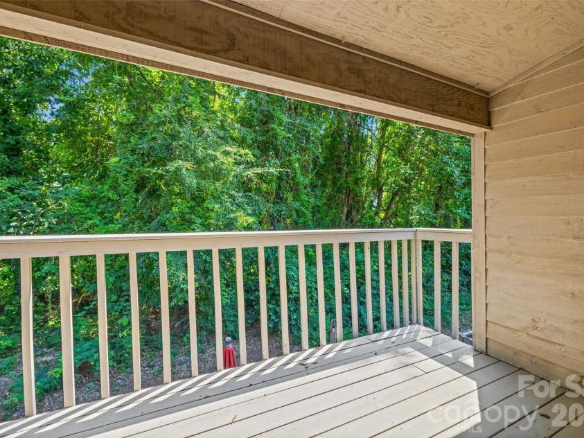 4160 Charlotte Highway, Lake Wylie, SC 29710.  MLS# CAR4422343, YatesRealty ID 49487. Tree views from ensuite deck