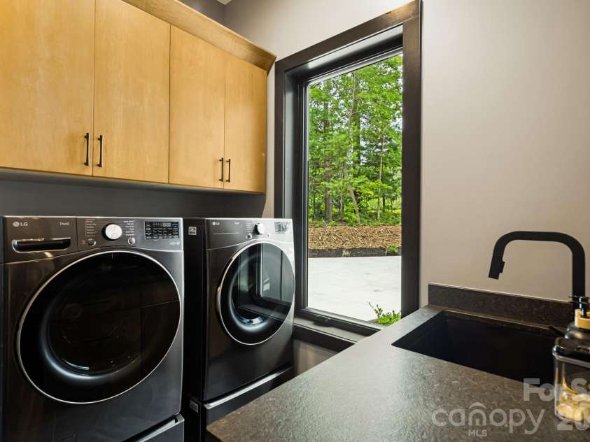 538 Pinnacle Mountain Preserve Road, Zirconia, NC 28790.  MLS# CAR4417464, YatesRealty ID 49488. Main level laundry room