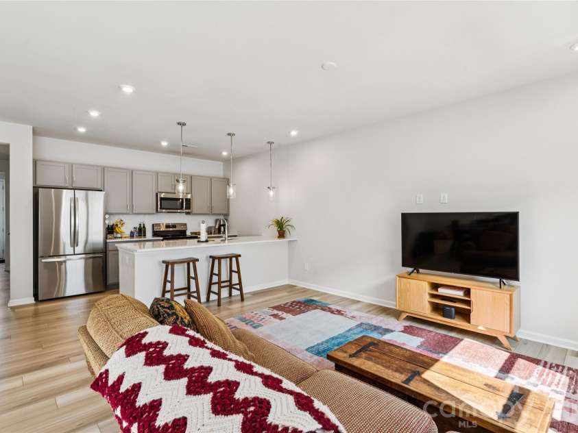 3132 Hutton Gardens Lane, Charlotte, NC 28269.  MLS# CAR4422591, YatesRealty ID 49489. Living Room into kitchen