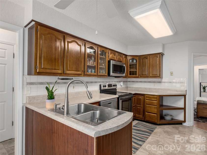 5 St Andrews Drive, Etowah, NC 28729.  MLS# CAR4419907, YatesRealty ID 49514. Spacious kitchen provides excellent workspace, storage, and an easy connection to the adjoining living areas.