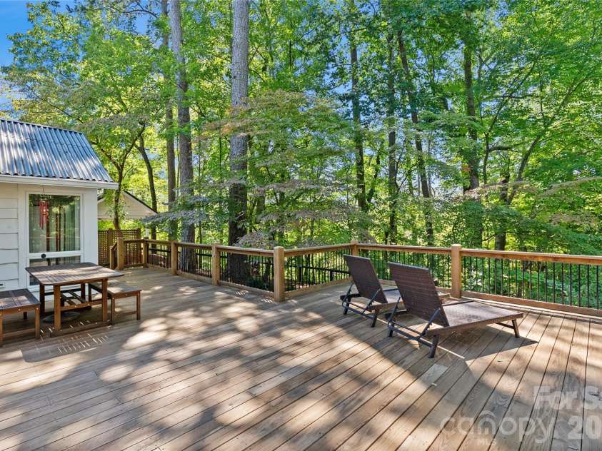 566 Canebrake Road, Tryon, NC 28782.  MLS# CAR4299420, YatesRealty ID 4954. Lots of outside space for entertaining and enjoying the views.