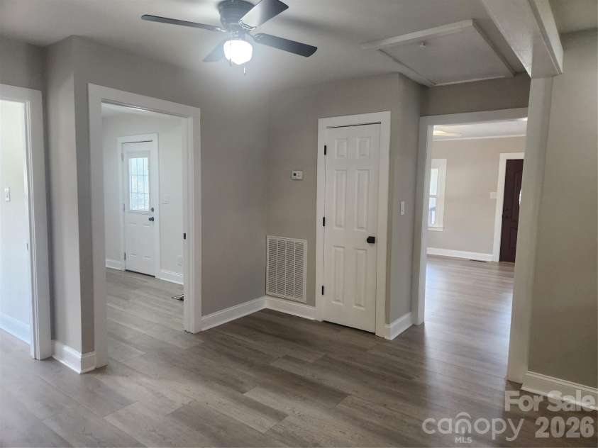 8 summit Avenue, Granite Falls, NC 28630.  MLS# CAR4422269, YatesRealty ID 49545. Entry into Kitchen from Living Room, Shows Side Door Entry from Porch/ Flex Space