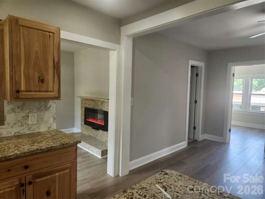 8 summit Avenue, Granite Falls, NC 28630.  MLS# CAR4422269, YatesRealty ID 49545. Kitchen Looking to Primary and Den/Bonus Space