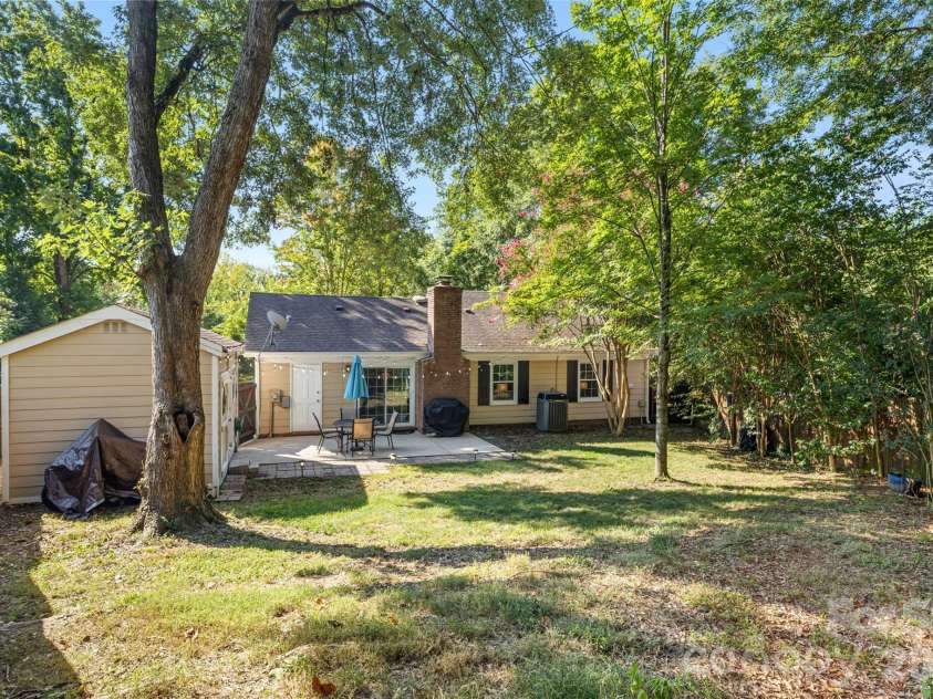 11714 Painted Tree Road, Charlotte, NC 28226.  MLS# CAR4421216, YatesRealty ID 49549. Backyard space with mature trees and open lawn area!