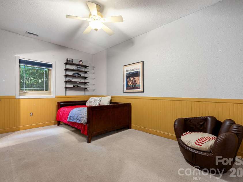 312 Forest Place, Candler, NC 28715.  MLS# CAR4419930, YatesRealty ID 49569. Downstairs bedroom 2.