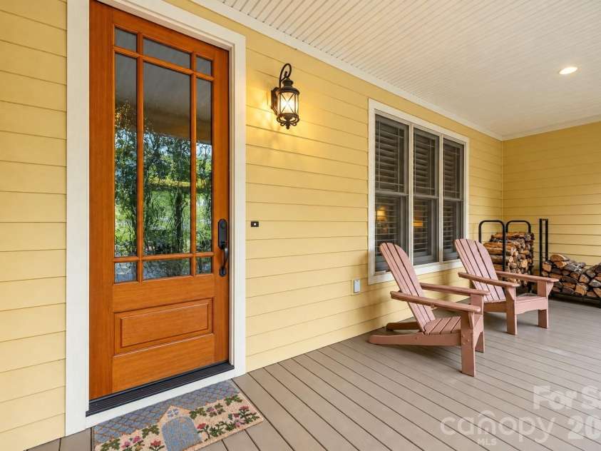 312 Forest Place, Candler, NC 28715.  MLS# CAR4419930, YatesRealty ID 49569. (front door touched-up by with AI)