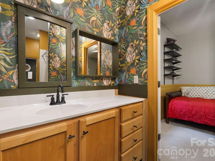 312 Forest Place, Candler, NC 28715.  MLS# CAR4419930, YatesRealty ID 49569. Jack and Jill bathroom connecting bedroom 2 + 3.