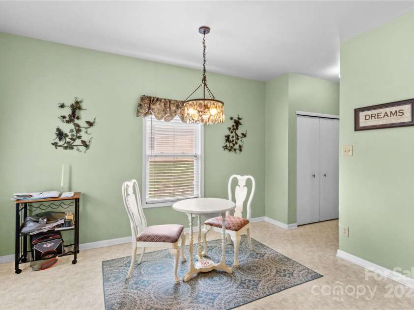 120 Vermillion Loop, Statesville, NC 28625.  MLS# CAR4243464, YatesRealty ID 4957. Breakfast area looking toward pantry, half bath and garage.