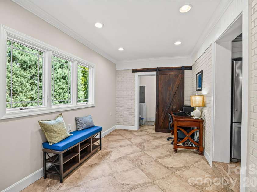 7400 Thorncliff Drive, Charlotte, NC 28210.  MLS# CAR4418127, YatesRealty ID 49580. Den and Laundry Room