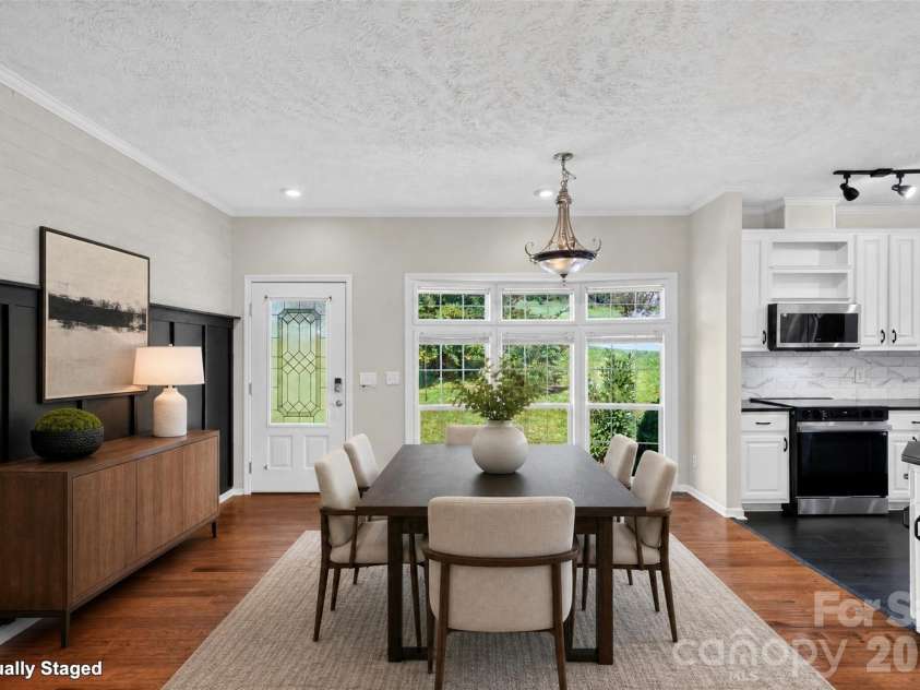 6 Enochs Way, Fletcher, NC 28732.  MLS# CAR4422708, YatesRealty ID 49593. Dining room and entryway (virtually staged)