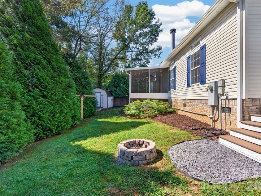 6 Enochs Way, Fletcher, NC 28732.  MLS# CAR4422708, YatesRealty ID 49593. Fenced year yard/firepit