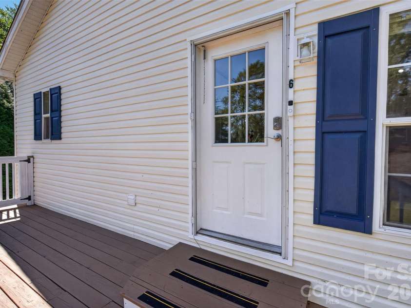 6 Enochs Way, Fletcher, NC 28732.  MLS# CAR4422708, YatesRealty ID 49593. Sunny side deck