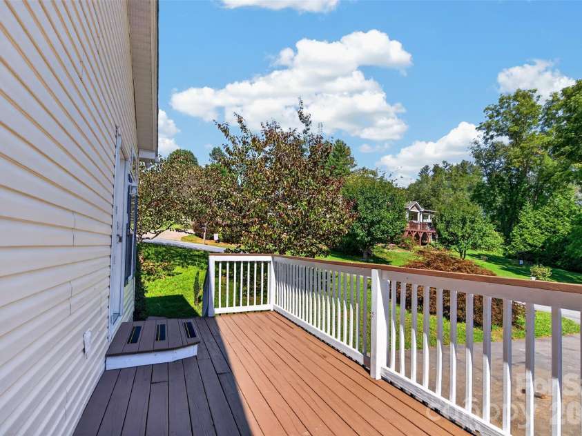 6 Enochs Way, Fletcher, NC 28732.  MLS# CAR4422708, YatesRealty ID 49593. Sunny side deck