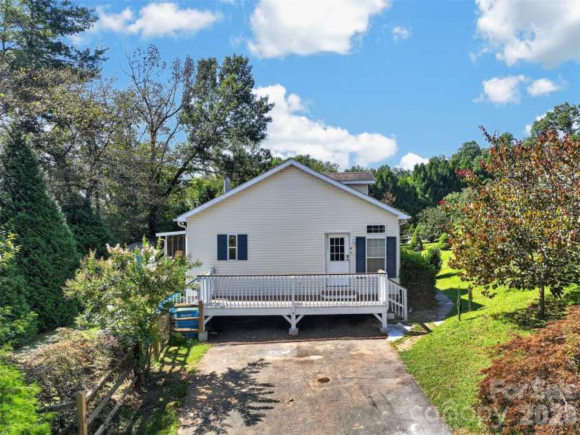 6 Enochs Way, Fletcher, NC 28732.  MLS# CAR4422708, YatesRealty ID 49593. Sunny side deck