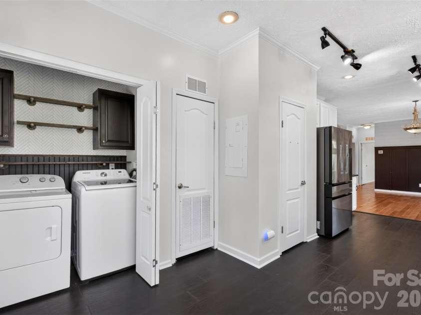 6 Enochs Way, Fletcher, NC 28732.  MLS# CAR4422708, YatesRealty ID 49593. Updated laundry area in kitchen