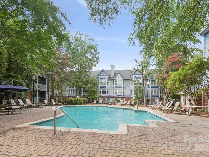 509 Graham Street, Charlotte, NC 28202.  MLS# CAR4292760, YatesRealty ID 4960. Wonderful pool surrounded by lush landscaping, private with fob entry for The Fourth Ward Square condo residents.
