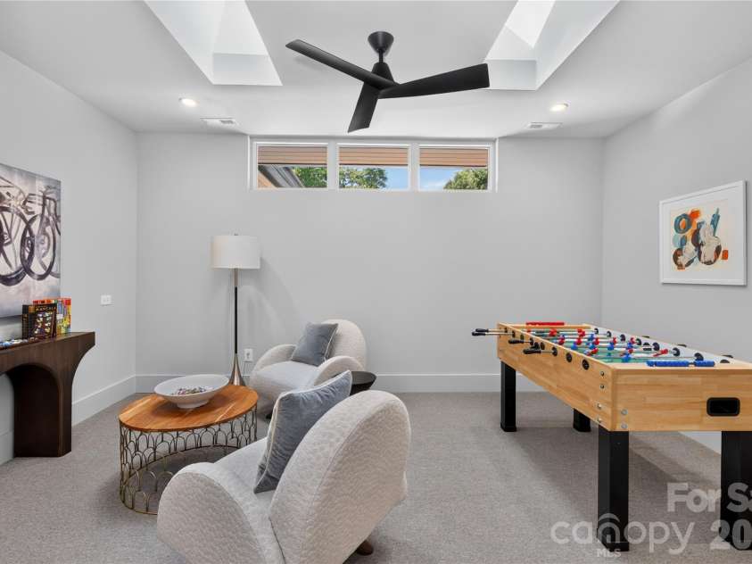 5620 Merry Mount Drive, Charlotte, NC 28226.  MLS# CAR4420251, YatesRealty ID 49600. Upper-level flex space illuminated by architectural skylights and high transom windows.